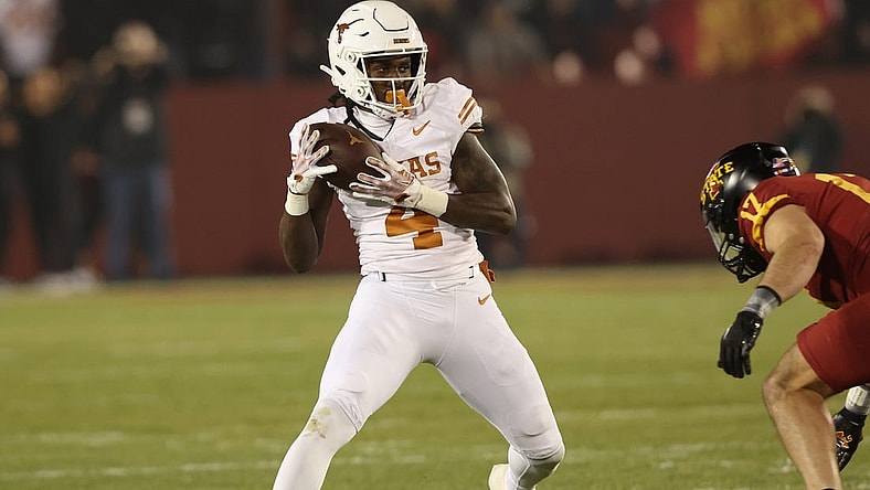 Nov 18, 2023; Ames, Iowa, USA; Texas Longhorns running back CJ Baxter (4) catches a pass against the Iowa State Cyclones at Jack Trice Stadium. Mandatory Credit: Reese Strickland-USA TODAY Sports