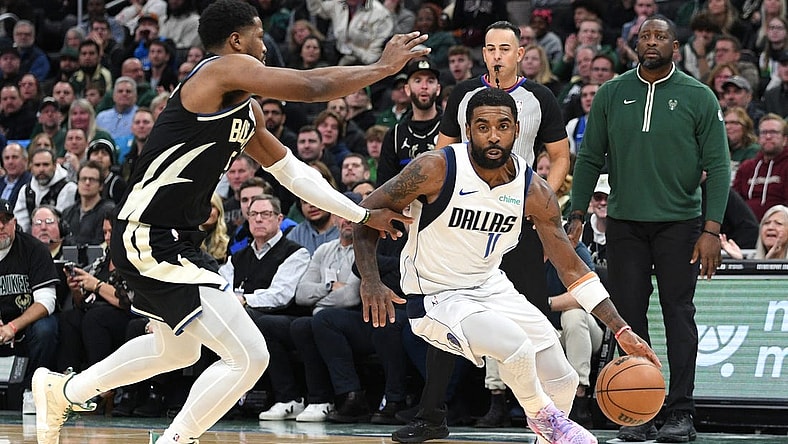 Nov 18, 2023; Milwaukee, Wisconsin, USA; Dallas Mavericks guard Kyrie Irving (11) drives to the basket against Milwaukee Bucks guard Cameron Payne (15) in the second half at Fiserv Forum. Mandatory Credit: Michael McLoone-USA TODAY Sports