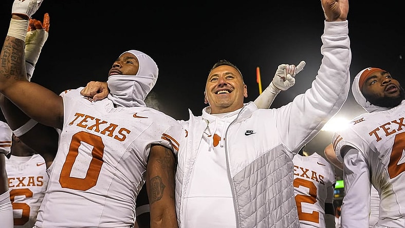 Nov 18, 2023; Ames, Iowa, USA; Texas Longhorns head coach Steve Sarkisian and linebacker Anthony Hill Jr. (0) hold up the sign of the horns after their win over the Iowa State Cyclones at Jack Trice Stadium. Mandatory Credit: Aaron E. Martinez-USA TODAY Sports