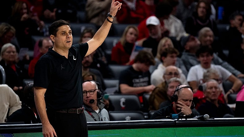 Cincinnati Bearcats head coach Wes Miller speaks to his players in the first half of the NCAA basketball game between the Cincinnati Bearcats and the Northern Kentucky Norse at Fifth Third Arena in Cincinnati on Sunday, Nov. 19, 2023.