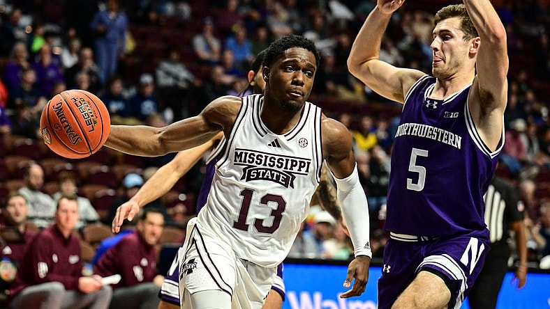 Nov 19, 2023; Uncasville, CT, USA;  Mississippi State Bulldogs guard Josh Hubbard (13) dribbles the ball challenged by Northwestern Wildcats guard Ryan Langborg (5) during the second halfat Mohegan Sun Arena. Mandatory Credit: Mark Smith-USA TODAY Sports