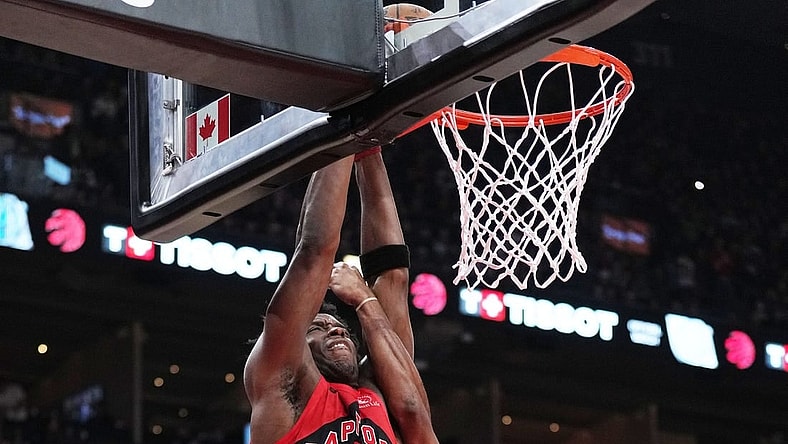 Nov 19, 2023; Toronto, Ontario, CAN; Toronto Raptors forward O.G. Anunoby (3) drives to the basket as Detroit Pistons guard Alec Burks (14) try to block during the second quarter at Scotiabank Arena. Mandatory Credit: Nick Turchiaro-USA TODAY Sports