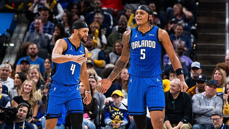 Nov 19, 2023; Indianapolis, Indiana, USA; Orlando Magic forward Paolo Banchero (5)  celebrates his made slam dunk with  guard Jalen Suggs (4) in the first half against the Indiana Pacers at Gainbridge Fieldhouse. Mandatory Credit: Trevor Ruszkowski-USA TODAY Sports