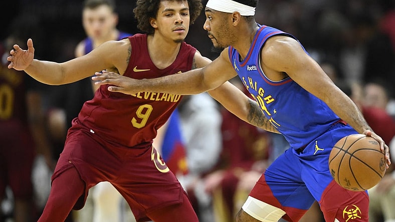 Nov 19, 2023; Cleveland, Ohio, USA; Denver Nuggets guard Jalen Pickett (24) drives against Cleveland Cavaliers guard Craig Porter (9) in the fourth quarter at Rocket Mortgage FieldHouse. Mandatory Credit: David Richard-USA TODAY Sports