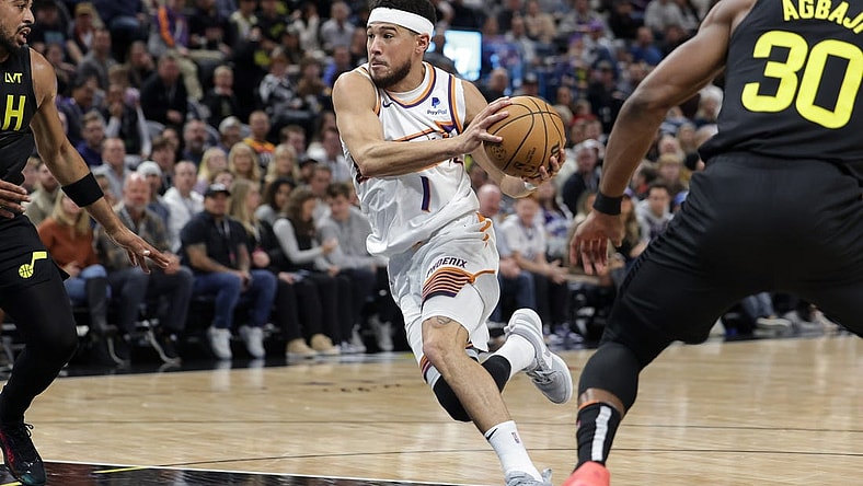 Nov 19, 2023; Salt Lake City, Utah, USA;  Phoenix Suns guard Devin Booker (1) drives to the basket during the second quarter against the Utah Jazz at Delta Center. Mandatory Credit: Chris Nicoll-USA TODAY Sports