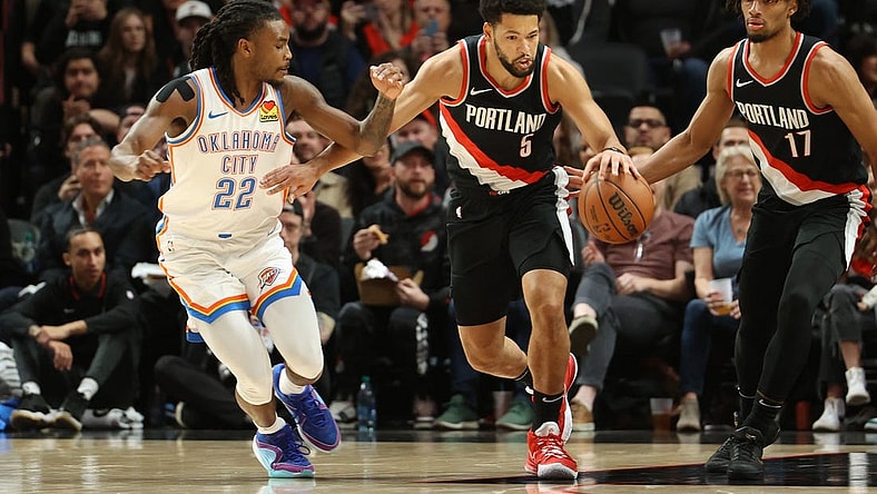Nov 19, 2023; Portland, Oregon, USA;  Portland Trail Blazers guard Skylar Mays (5) dribbles up the court past Oklahoma City Thunder guard Cason Wallace (22) in the first half at Moda Center. Mandatory Credit: Jaime Valdez-USA TODAY Sports