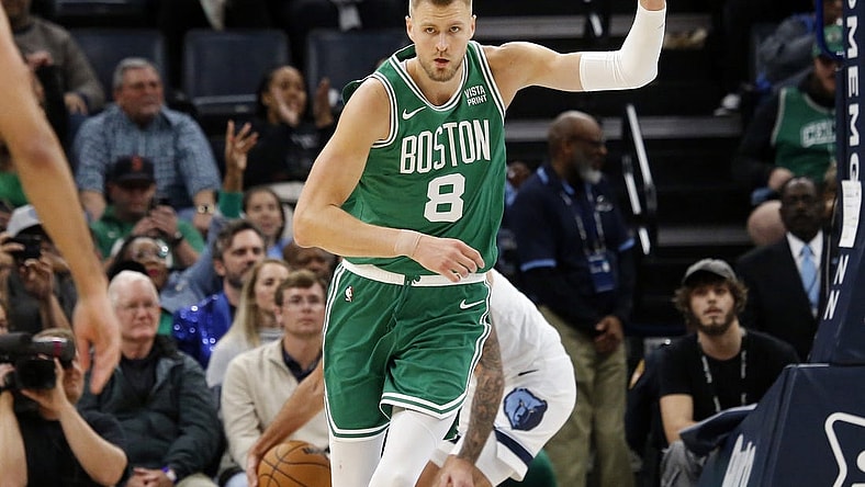 Nov 19, 2023; Memphis, Tennessee, USA; Boston Celtics center Kristaps Porzingis (8) reacts after a dunk during the second half against the Memphis Grizzlies at FedExForum. Mandatory Credit: Petre Thomas-USA TODAY Sports