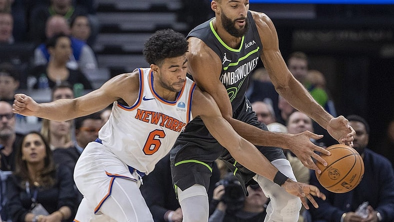 Nov 20, 2023; Minneapolis, Minnesota, USA; New York Knicks guard Quentin Grimes (6) and Minnesota Timberwolves center Rudy Gobert (27) go after a loose ball in the first half at Target Center. Mandatory Credit: Jesse Johnson-USA TODAY Sports