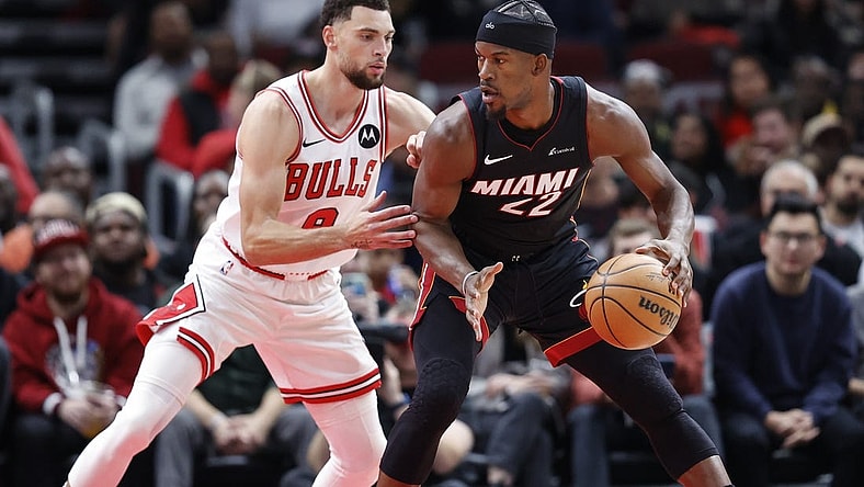 Nov 20, 2023; Chicago, Illinois, USA; Chicago Bulls guard Zach LaVine (8) defends against Miami Heat forward Jimmy Butler (22) during the first half at United Center. Mandatory Credit: Kamil Krzaczynski-USA TODAY Sports