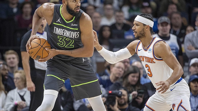 Nov 20, 2023; Minneapolis, Minnesota, USA; Minnesota Timberwolves center Karl-Anthony Towns (32) looks to pass the ball over New York Knicks guard Josh Hart (3) in the first half at Target Center. Mandatory Credit: Jesse Johnson-USA TODAY Sports