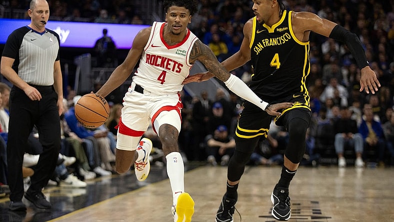 Nov 20, 2023; San Francisco, California, USA; Houston Rockets guard Jalen Green (4) dribbles against Golden State Warriors guard Moses Moody (4) during the third quarter at Chase Center. Mandatory Credit: D. Ross Cameron-USA TODAY Sports