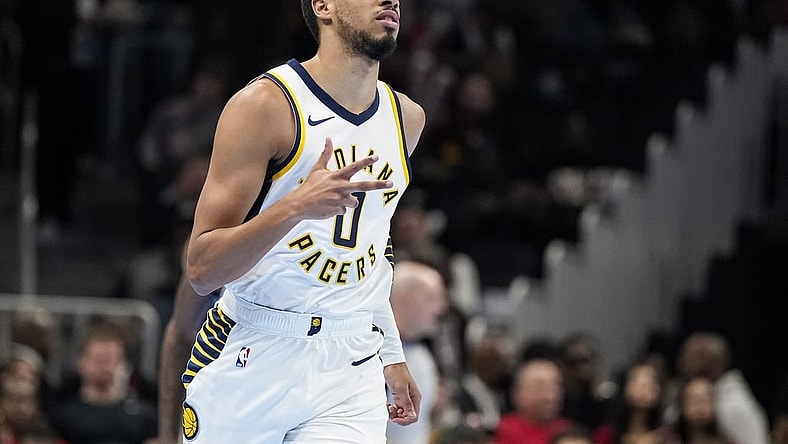 Nov 21, 2023; Atlanta, Georgia, USA; Indiana Pacers guard Tyrese Haliburton (0) reacts after a three point basket against the Atlanta Hawks during the first half at State Farm Arena. Mandatory Credit: Dale Zanine-USA TODAY Sports