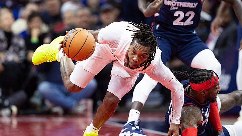 Nov 21, 2023; Philadelphia, Pennsylvania, USA; Cleveland Cavaliers guard Darius Garland (10) picks up a loose ball past Philadelphia 76ers forward Robert Covington (33) during the fourth quarter at Wells Fargo Center. Mandatory Credit: Bill Streicher-USA TODAY Sports
