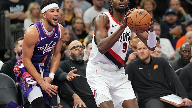 Nov 21, 2023; Phoenix, Arizona, USA; Phoenix Suns guard Devin Booker (1) shouts from the bench as Portland Trail Blazers forward Jerami Grant (9) shoots during the second half at Footprint Center. Mandatory Credit: Joe Camporeale-USA TODAY Sports