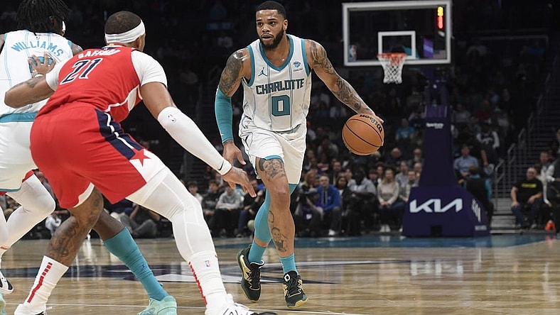 Nov 22, 2023; Charlotte, North Carolina, USA; Charlotte Hornets forward Miles Bridges (0) looks to drive during the first half against the Washington Wizards at the Spectrum Center. Mandatory Credit: Sam Sharpe-USA TODAY Sports