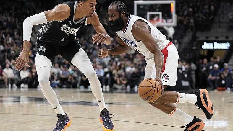 Nov 22, 2023; San Antonio, Texas, USA; Los Angeles Clippers guard James Harden (1) drives to the basket against San Antonio Spurs forward Victor Wembanyama (1) during the first half at Frost Bank Center. Mandatory Credit: Scott Wachter-USA TODAY Sports