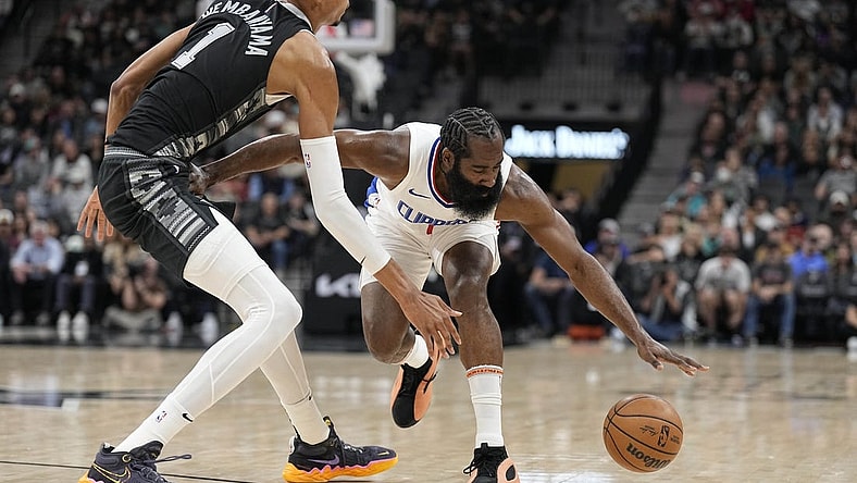 Nov 22, 2023; San Antonio, Texas, USA; Los Angeles Clippers guard James Harden (1) loses control of the ball while defended by San Antonio Spurs forward Victor Wembanyama (1) during the first half at Frost Bank Center. Mandatory Credit: Scott Wachter-USA TODAY Sports
