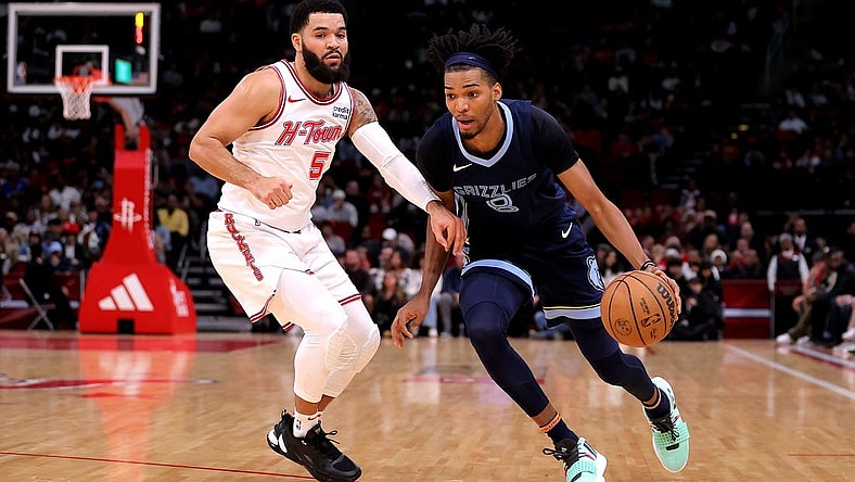 Nov 22, 2023; Houston, Texas, USA; Memphis Grizzlies forward Ziaire Williams (8) handles the ball against Houston Rockets guard Fred VanVleet (5) during the first quarter at Toyota Center. Mandatory Credit: Erik Williams-USA TODAY Sports