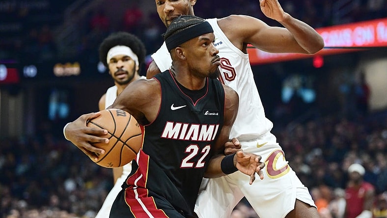 Nov 22, 2023; Cleveland, Ohio, USA; Miami Heat forward Jimmy Butler (22) drives to the basket against Cleveland Cavaliers forward Evan Mobley (4) during the first quarter at Rocket Mortgage FieldHouse. Mandatory Credit: Ken Blaze-USA TODAY Sports