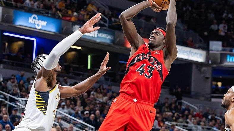 Nov 22, 2023; Indianapolis, Indiana, USA; Toronto Raptors forward Pascal Siakam (43) shoots the ball while Indiana Pacers guard Buddy Hield (left) defends in the first half at Gainbridge Fieldhouse. Mandatory Credit: Trevor Ruszkowski-USA TODAY Sports