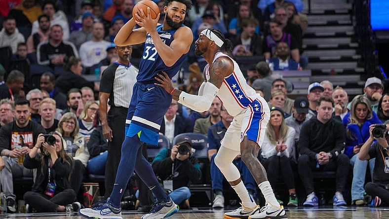 Nov 22, 2023; Minneapolis, Minnesota, USA; Philadelphia 76ers forward Robert Covington (33) defends Minnesota Timberwolves center Karl-Anthony Towns (32) in the second quarter at Target Center. Mandatory Credit: Brad Rempel-USA TODAY Sports