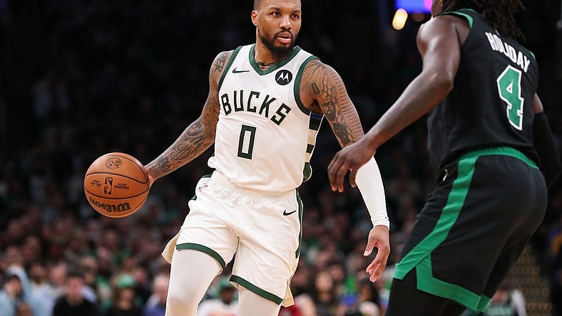 Nov 22, 2023; Boston, Massachusetts, USA; Milwaukee Bucks guard Damian Lillard (0) dribbles down the court during the second half against the Boston Celtics at TD Garden. Mandatory Credit: Paul Rutherford-USA TODAY Sports