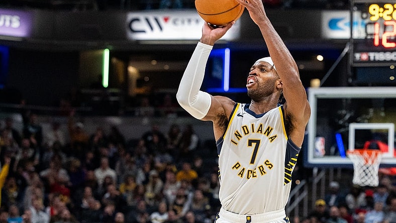 Nov 22, 2023; Indianapolis, Indiana, USA; Indiana Pacers guard Buddy Hield (7) shoots the ball in the second half against the Toronto Raptors at Gainbridge Fieldhouse. Mandatory Credit: Trevor Ruszkowski-USA TODAY Sports