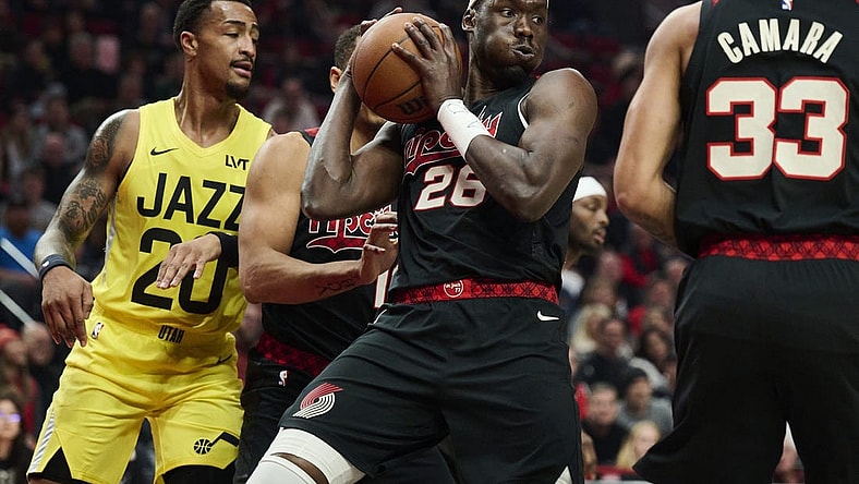 Nov 22, 2023; Portland, Oregon, USA; Portland Trail Blazers center Duop Reath (26) grabs an defensive rebound during the first half against the Utah Jazz at Moda Center. Mandatory Credit: Troy Wayrynen-USA TODAY Sports