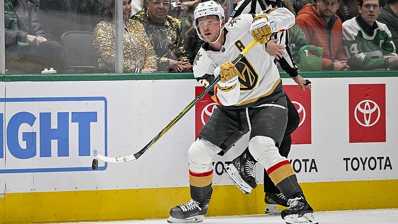 Nov 22, 2023; Dallas, Texas, USA; Vegas Golden Knights center Jack Eichel (9) passes the puck against the Dallas Stars during the third period at the American Airlines Center. Mandatory Credit: Jerome Miron-USA TODAY Sports