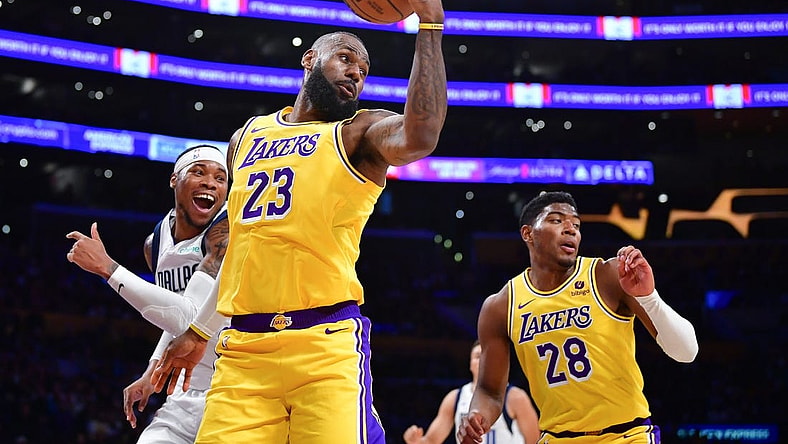 Nov 22, 2023; Los Angeles, California, USA; Los Angeles Lakers forward LeBron James (23) gets the rebound against the Dallas Mavericks during the first half at Crypto.com Arena. Mandatory Credit: Gary A. Vasquez-USA TODAY Sports
