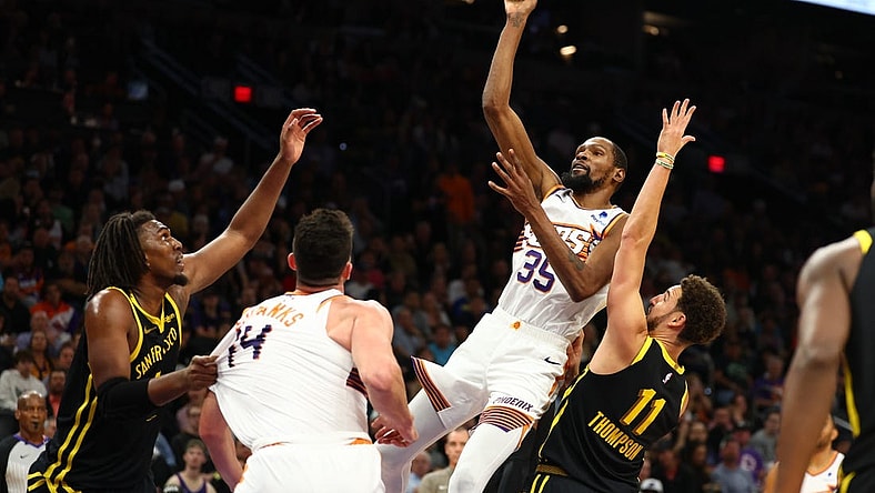 Nov 22, 2023; Phoenix, Arizona, USA; Phoenix Suns forward Kevin Durant (35) shoots the ball against the Golden State Warriors in the second half at Footprint Center. Mandatory Credit: Mark J. Rebilas-USA TODAY Sports