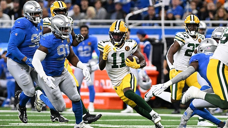 Nov 23, 2023; Detroit, Michigan, USA; Green Bay Packers wide receiver Jayden Reed (11) runs the ball against the Detroit Lions in the first quarter at Ford Field. Mandatory Credit: Lon Horwedel-USA TODAY Sports