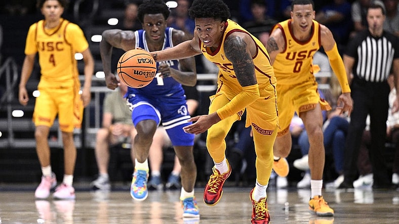 Nov 23, 2023; La Jolla, California, USA; USC Trojans guard Boogie Ellis (5) grabs a loose ball during the first half against the Seton Hall Pirates at LionTree Arena. Mandatory Credit: Orlando Ramirez-USA TODAY Sports