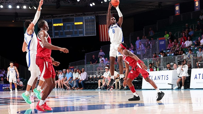 Nov 23, 2023; Paradise Island, BAHAMAS; Memphis Tigers forward David Jones (8) scores over Arkansas Razorbacks forward Chandler Lawson (8) right before halftime at Imperial Arena. Mandatory Credit: Kevin Jairaj-USA TODAY Sports