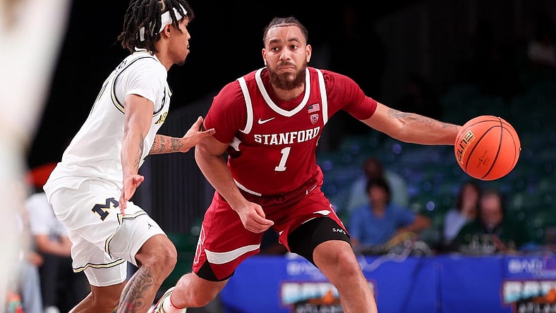 Nov 23, 2023; Paradise Island, BAHAMAS;  Stanford Cardinal guard Jared Bynum (1) drives to the basket as Michigan Wolverines guard Dug McDaniel (0) defends during the second half at Imperial Arena. Mandatory Credit: Kevin Jairaj-USA TODAY Sports