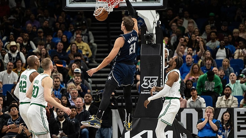 Nov 24, 2023; Orlando, Florida, USA; Orlando Magic forward Moritz Wagner (21) dunks the ball against the Boston Celtics in the second quarter at Amway Center. Mandatory Credit: Jeremy Reper-USA TODAY Sports