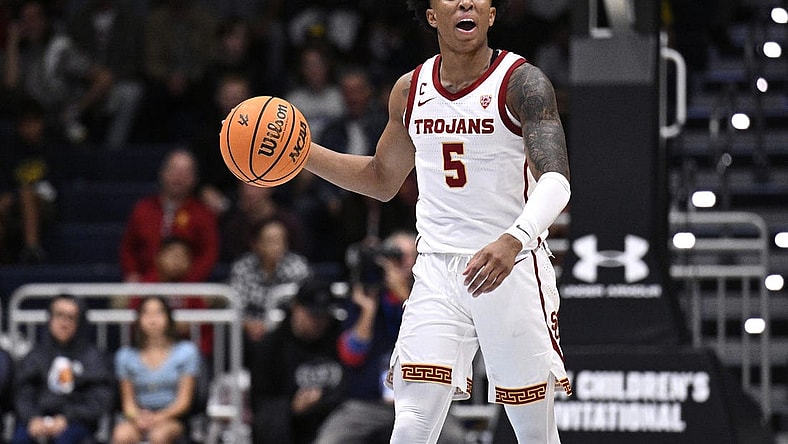 Nov 24, 2023; La Jolla, California, USA; USC Trojans guard Boogie Ellis (5) dribbles the ball during the first half against the Oklahoma Sooners at LionTree Arena. Mandatory Credit: Orlando Ramirez-USA TODAY Sports