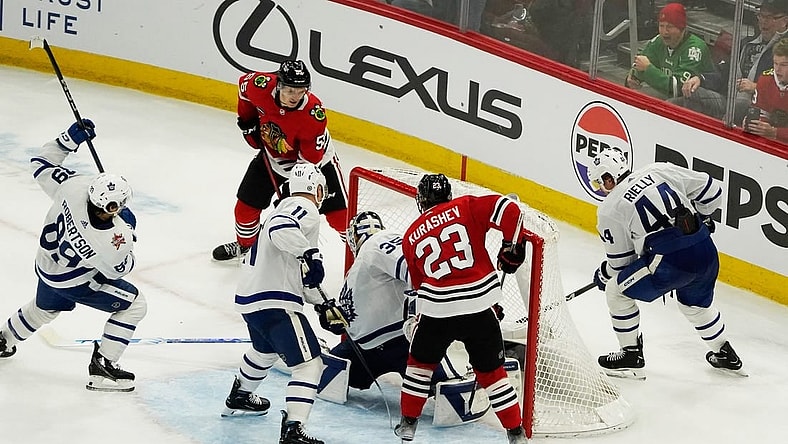 Nov 24, 2023; Chicago, Illinois, USA; Chicago Blackhawks defenseman Kevin Korchinski (55) scores the game winning goal during an overtime period against the Toronto Maple Leafs at United Center. Mandatory Credit: David Banks-USA TODAY Sports