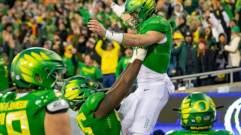 Oregon quarterback Bo Nix is hoisted into the air after a touchdown as the No. 6 Oregon Ducks take on the No. 16 Oregon State Beavers Friday, Nov. 24, 2023, at Autzen Stadium in Eugene, Ore.