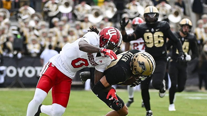 Nov 25, 2023; West Lafayette, Indiana, USA; Purdue Boilermakers defensive back Cam Allen (10) intercepts a pass intended for Indiana Hoosiers wide receiver Andison Coby (0) during the first half at Ross-Ade Stadium. Mandatory Credit: Robert Goddin-USA TODAY Sports