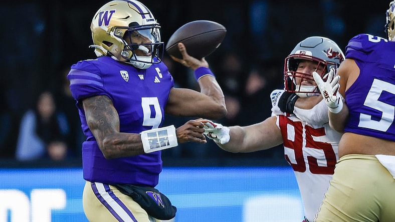 Nov 25, 2023; Seattle, Washington, USA; Washington Huskies quarterback Michael Penix Jr. (9) passes against the Washington State Cougars during the first quarter at Alaska Airlines Field at Husky Stadium. Mandatory Credit: Joe Nicholson-USA TODAY Sports