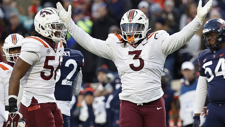 Nov 25, 2023; Charlottesville, Virginia, USA; Virginia Tech Hokies defensive lineman Norell Pollard (3) celebrates after recording a sack against the Virginia Cavaliers during the second quarter at Scott Stadium. Mandatory Credit: Geoff Burke-USA TODAY Sports
