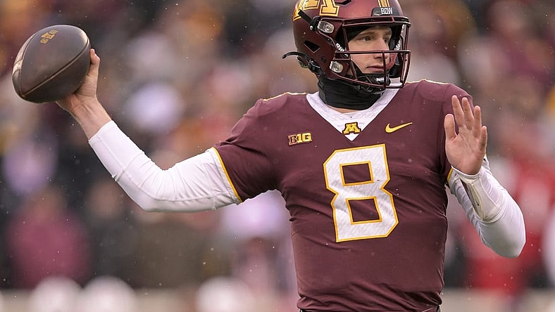 Nov 25, 2023; Minneapolis, Minnesota, USA;  Minnesota Golden Gophers quarterback Athan Kaliakmanis (8) makes a throw against the Wisconsin Badgers during the second quarter at Huntington Bank Stadium. Mandatory Credit: Nick Wosika-USA TODAY Sports