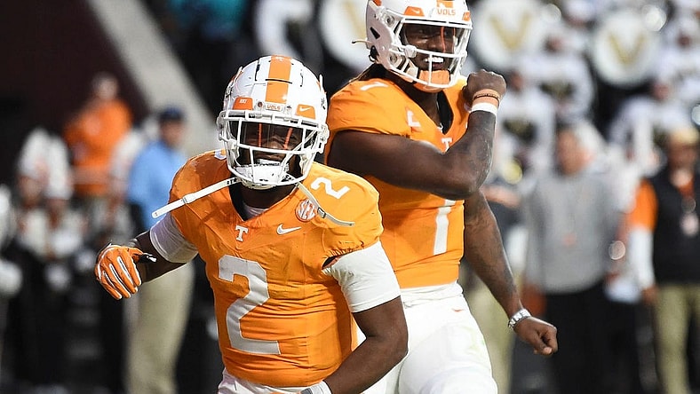 Tennessee quarterback Joe Milton III (7) and Jabari Small (2) celebrate Milton's touchdown during an NCAA college football game against Vanderbilt on Saturday, November 25, 2023 in Knoxville, Tenn.