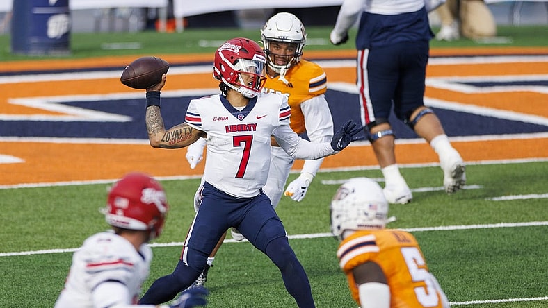 Nov 25, 2023; El Paso, Texas, USA; No. 22 Liberty Flames quarterback Kaidon Salter (7) tries throws the ball against the UTEP Miners defense during the first half at Sun Bowl Stadium. Mandatory Credit: Ivan Pierre Aguirre-USA TODAY Sports