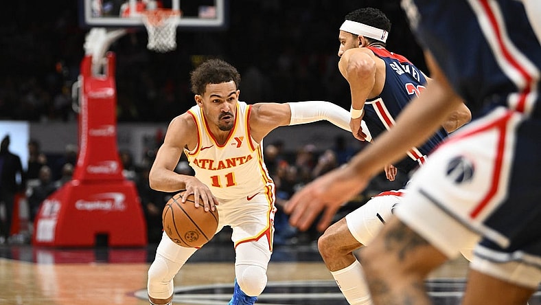 Nov 25, 2023; Washington, District of Columbia, USA; Atlanta Hawks guard Trae Young (11) dribbles against the Washington Wizards during the first half at Capital One Arena. Mandatory Credit: Brad Mills-USA TODAY Sports