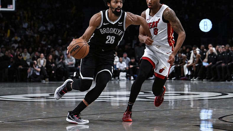 Nov 25, 2023; Brooklyn, New York, USA; Brooklyn Nets guard Spencer Dinwiddie (26) drives against Miami Heat forward Jamal Cain (8) during the fourth quarter at Barclays Center. Mandatory Credit: John Jones-USA TODAY Sports