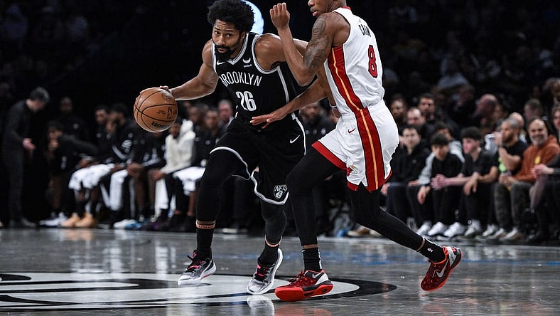 Nov 25, 2023; Brooklyn, New York, USA; Brooklyn Nets guard Spencer Dinwiddie (26) drives against Miami Heat forward Jamal Cain (8) during the third quarter at Barclays Center. Mandatory Credit: John Jones-USA TODAY Sports