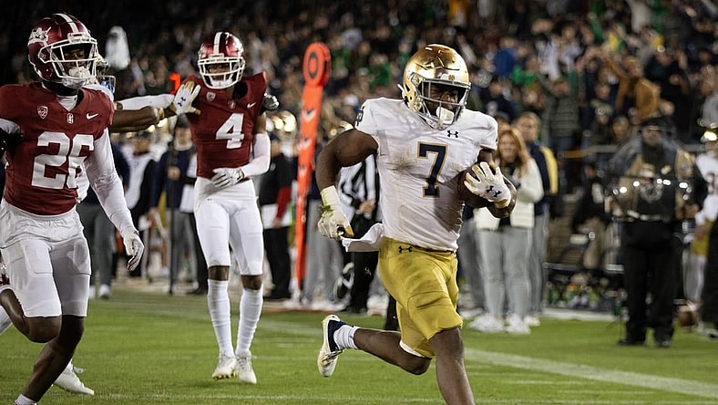 Nov 25, 2023; Stanford, California, USA; Notre Dame Fighting Irish running back Audric Estim   (7) breaks free for another touchdown run against the Stanford Cardinal during the third quarter at Stanford Stadium. Mandatory Credit: D. Ross Cameron-USA TODAY Sports