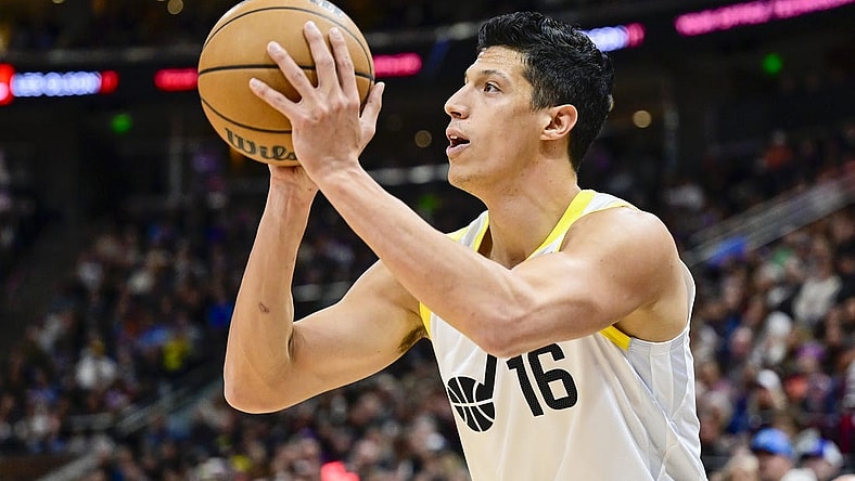 Nov 25, 2023; Salt Lake City, Utah, USA; Utah Jazz forward Simone Fontecchio (16) shoots the ball against the New Orleans Pelicans during the first half at Delta Center. Mandatory Credit: Christopher Creveling-USA TODAY Sports